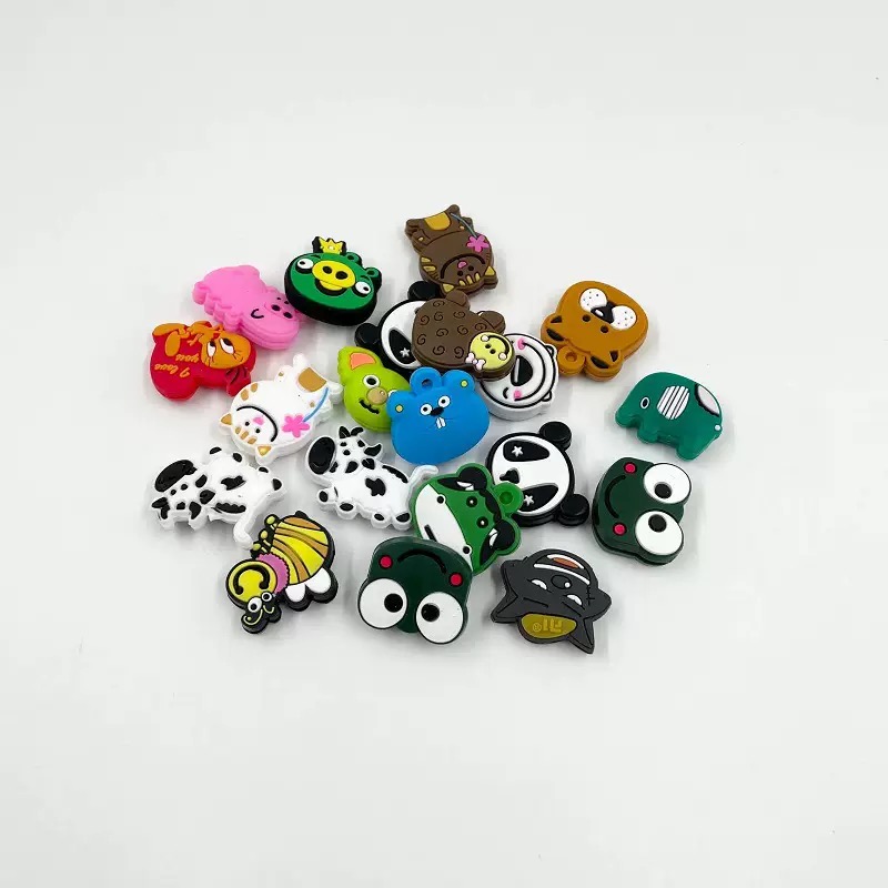 Colorful assortment of graphic and character-shaped tennis dampeners