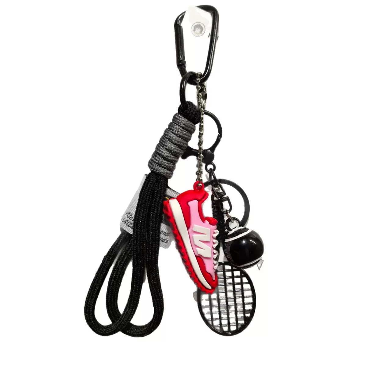 Tennis-themed bag charm accessory set with racquet and ball details
