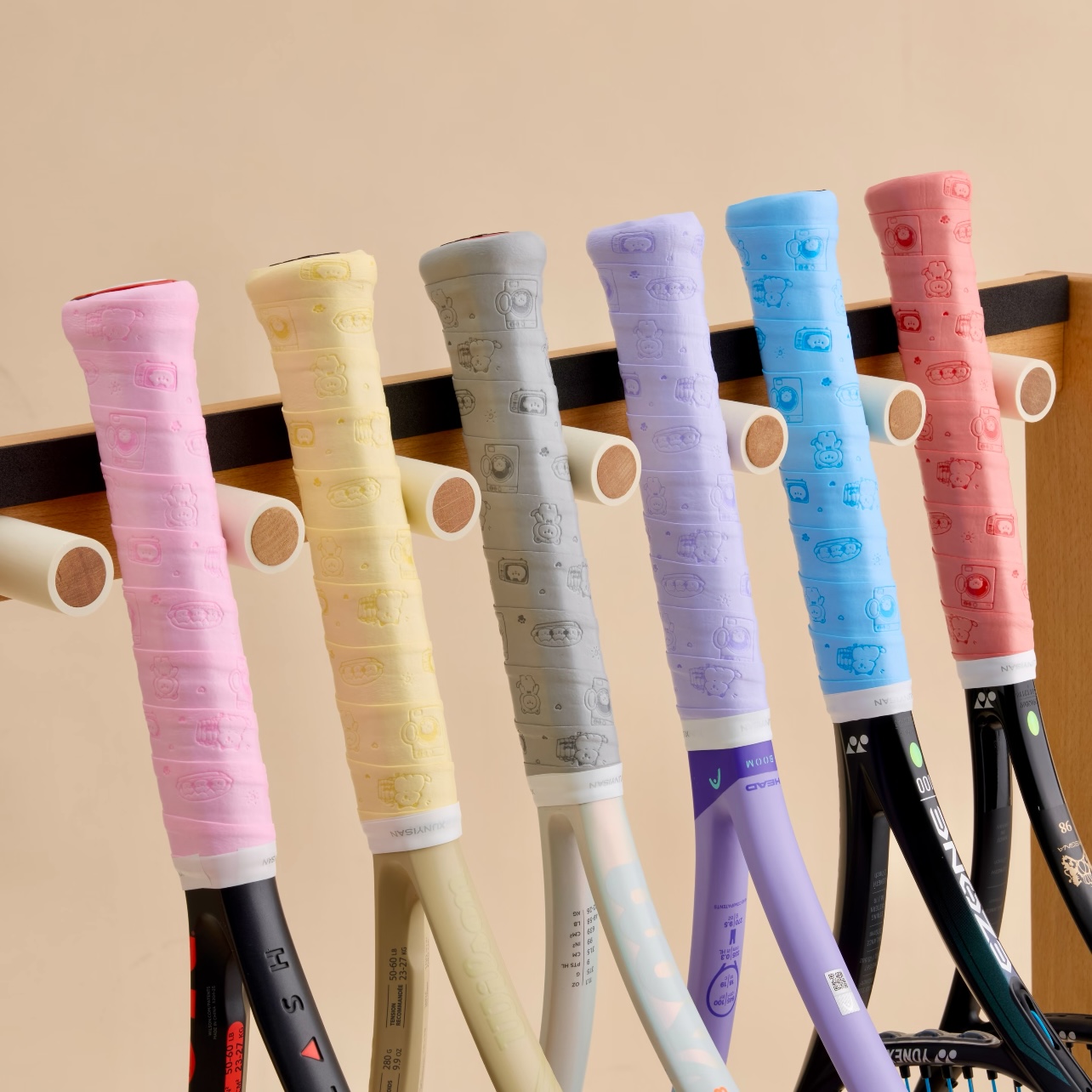 Tennis and pickleball racquets wrapped with custom-color overgrips