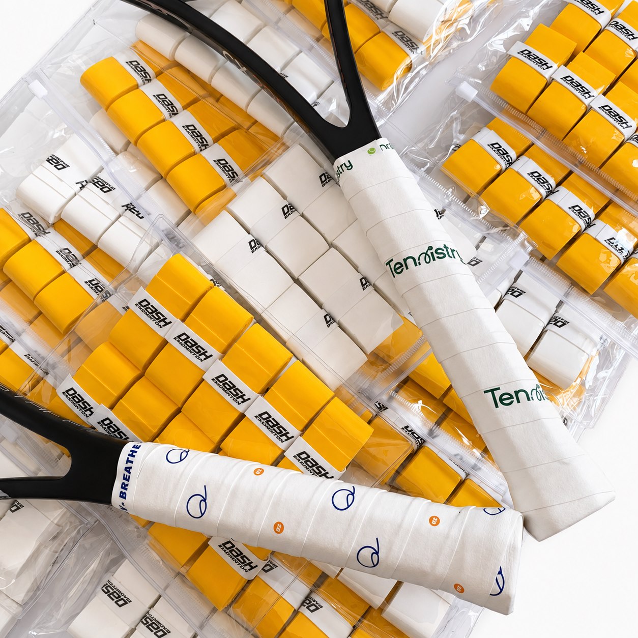Large production batch of yellow and white custom overgrips